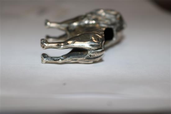An Edwardian silver pincushion in the form of a standing lion (cushion and tail deficient),